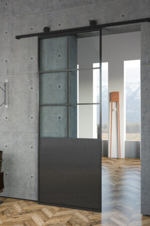 Porta scorrevole esterno parete indy industrial 2-1 Porta scorrevole a parete binario con ruote esterne anta vetro trasparente con bordo e bugna inferiore in alluminio nero.Design industriale